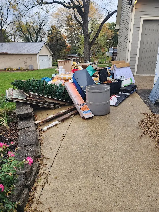 Dumpster being loaded with debris for Residential Dumpster Rental in Oradell